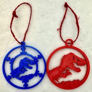 Two (2) Jurassic Park T-Rex 3" Plastic Christmas Ornaments Red & Blue